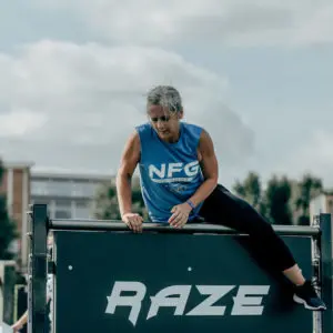 person climbing over wall